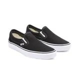 Championes Vans Classic Slip-On negros con suela blanca.