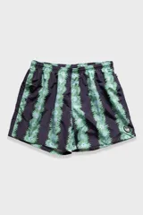 Short de baño negro con estampado de flores verdes y celestes, cintura elástica con cordón regulable, bolsillos laterales y trasero con cierre, suspensor de malla fina hipoalergénico.