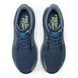 Championes de running New Balance modelo 1080 V12 para hombre, color azul con detalles en amarillo. Confeccionados con tecnología Hypoknit y entresuela Fresh Foam X.