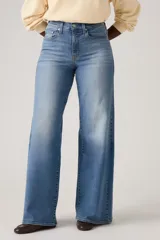 Jean de tiro alto y corte wide leg en color azul con efecto deslavado. Confeccionado en mezcla de algodón, poliéster y elastano, de elasticidad baja.