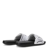 Sandalias Puma Royalcat Comfort 2, con base negra y tira ancha blanca con el logo de la marca en negro.