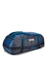 Bolso de viaje tipo duffel marca Thule, modelo Chasm de 130 litros, en color azul. Cuenta con gran apertura superior, correas convertibles para usar como mochila y diseño resistente.