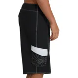Short de baño Billabong modelo A.I. Rising Sun Pro, en color negro y blanco, con diseño asimétrico de franjas diagonales, cordón ajustable en la cintura y tejido elástico.