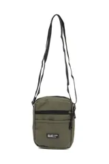 Morral color gris oscuro con correa ajustable negra. Cuenta con un compartimento principal con cierre, un bolsillo frontal con cierre y un bolsillo frontal abierto. Tiene un parche con la inscripción "NOT JUST A BAG. casual and effortless style".