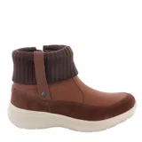 Botas de caña baja color negro, con cierre lateral y detalle de cuello tejido.