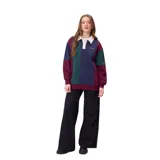 Buzo estilo rugby de la marca Rusty, con diseño color block en tonos bordó, verde y azul marino. Presenta cuello polo en color crema con cierre frontal de botones, mangas largas con puños elásticos y logo bordado en el pecho.