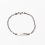 Pulsera de eslabones tipo cubana, color plateado, con placa central lisa para grabar. Cierre de mosquetón.