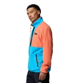 Campera de polar Columbia modelo Backbowl II, con diseño color block en naranja y azul. Presenta cierre frontal completo, cuello alto y bolsillos laterales con cierre.