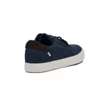 Zapatillas acordonadas de lona azul con suela blanca y detalles en cuero marrón en el talón.