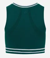 Top deportivo de microfibra seamless, color verde con detalles de rayas blancas en el cuello y el ruedo. Presenta un diseño alargado con cuello redondo y copas integradas.
