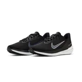 Championes Nike Air Winflo 9 para hombre, color negro con detalles en blanco y gris. Presentan una capellada de malla texturizada, logo Nike Swoosh en gris/azul claro con borde blanco, y una entresuela gruesa blanca con detalles negros.