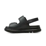 Sandalia de plataforma Korium Confort modelo Kacey, color negro, con dos tiras ajustables con hebillas doradas y tira trasera de sujeción. Suela gruesa dentada.