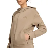 Campera deportiva Adidas modelo Designed for Training, color caqui, con capucha, cierre frontal completo y bolsillos laterales con cierre. Presenta el logo de la marca sutilmente bordado en el pecho.