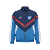 Campera deportiva Umbro del Club Nacional de Football, modelo Beat. Diseño con cierre frontal, cuello alto y bloques de color en azul marino, celeste, rojo y blanco, con el escudo del club y el logo de Umbro bordados en el pecho.
