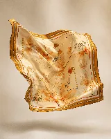 Pañuelo cuadrado de seda natural con diseño artístico abstracto en tonos tierra, ocres y grises, con borde ancho en color bordó y terminaciones cosidas a mano.