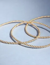 Pulsera elástica de cuentas de 2mm en oro laminado 14 Kilates (Goldfilled).