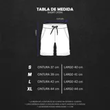 Short deportivo de lycra color azul marino con cordón de ajuste negro. Presenta ribetes y un pequeño logo de alas en color dorado/beige en la parte inferior izquierda.