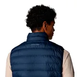 Chaleco acolchado de diseño técnico, color azul marino, con cierre frontal completo, cuello alto y bolsillos laterales con cierre. Presenta tecnología reflectante térmica y acabado resistente al agua.