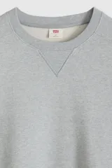Buzo de cuello redondo con detalle de costura triangular en el escote, confeccionado en algodón con diseño de calce relajado y puños y ruedo acanalados.