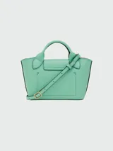 Cartera tipo shopper tamaño XS de la línea Épure de Longchamp, confeccionada en cuero de color verde menta. Presenta una estructura rígida, asas cortas superiores y un cierre de solapa con botón a presión metálico dorado.