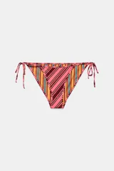 Braguita de bikini de tiro medio con diseño reversible, ajustable mediante lazadas laterales. Presenta un estampado de rayas diagonales en tonos rosados, naranjas y azulados.