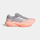 Championes de running Adidas Supernova Rise, con tecnología de amortiguación Dreamstrike+ en la mediasuela para una pisada suave y estable. Presentan un diseño en tonos naranja y gris, con exterior de tela y sintético, y suela de caucho.