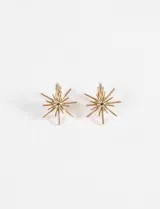 Par de caravanas doradas con forma de estrella fugaz y cierre a clip.