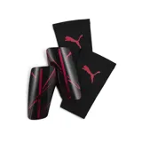 Canilleras Puma Attacanto azules con logo de Puma en blanco.