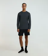 Remera deportiva de manga larga Get Over color gris melange, con cuello redondo y confeccionada en tejido tecnológico de secado rápido.
