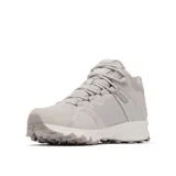Bota de senderismo Columbia modelo Peakfreak Hera Mid, color blanco hueso. Presenta un diseño de caña media con tecnología impermeable OutDry, sistema de ajuste Navic Fit en el mediopié y suela con tacos de 5 mm para tracción en terrenos difíciles.