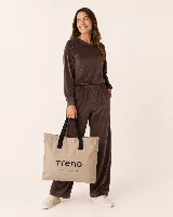 Bolso tote de lona color visón con asas cortas negras y estampado frontal con la marca "Trena" y el lema "ACTIVA TUS DÍAS".