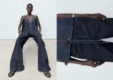 Jean de tiro bajo con diseño wide leg, confeccionado en tejido de algodón estilo denim. Cuenta con cierre de botón y cremallera, trabillas para cinturón y cinco bolsillos.