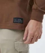 Remera de manga larga color marrón, con cuello redondo y puños acanalados.