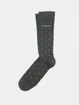 Medias largas de color gris oscuro con lunares verde claro y logo de la marca Tranquera en verde claro. Talle aproximado 39-44.