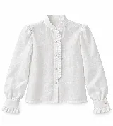 Blusa blanca de lino con cuello mao, mangas largas abullonadas, puños con volados y detalle de volado sutil en la cartera de botones frontal.