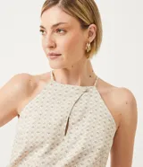 Blusa musculosa con cuello halter y estampado geométrico.