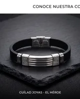 Pulsera masculina con diseño de guarda griega, combinando eslabones de acero inoxidable y banda de goma negra. Cuenta con cierre de seguridad.
