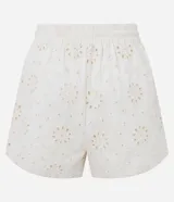 Short femenino de tiro alto color crudo, confeccionado en sarga con textura floral calada de broderie. Cuenta con cintura elástica y cordón ajustable para anudar.