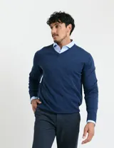 Sweater de punto con cuello en V y mangas largas con puños acanalados.