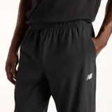 Pantalón deportivo New Balance de hombre, modelo Stretch, color negro con cintura elástica y logo blanco en la pierna izquierda.