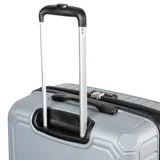 Valija grande plateada de policarbonato, con candado TSA, cuatro ruedas y compartimento interno con cierre.