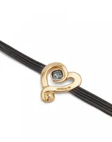 Pulsera de cuero marrón con dije de corazón dorado con cristal negro.