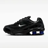 Zapatillas deportivas Nike Shox Ride 2, color negro con detalles en azul eléctrico en la amortiguación Shox y logo Nike plateado.