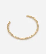 Gargantilla rígida dorada con forma de bambú. Accesorio de bisutería con baño light gold.