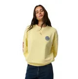 Buzo Rip Curl de fleece, modelo Sg Heritage Oversized, color amarillo, con cuello redondo y diseño holgado. Presenta un pequeño estampado circular en el pecho y letras estampadas en la manga.