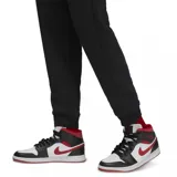 Pantalon de jogging Jordan modelo Brooklyn Fleece, color negro, con cintura elástica ajustable mediante cordón, puños acanalados en los tobillos y logo Jumpman bordado en contraste en la pierna izquierda.