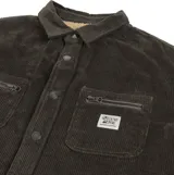 Campera tipo overshirt de pana color negro, con cierre frontal de botones metálicos, bolsillos superiores con cierre y forro interior de corderito.