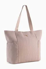 Bolso tipo shopper Puma Up de color negro, con asas de hombro y el logo de la marca en dorado en la parte frontal.