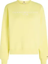 Buzo de cuello redondo Tommy Hilfiger color amarillo pastel, confeccionado en mezcla de algodón y poliéster. Presenta hombros caídos, puños y bajo de punto canalé, con el logo de la marca estampado en el pecho y bordado en la manga.