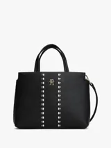 Cartera tipo satchel de Tommy Hilfiger en color negro, confeccionada en material texturizado. Presenta doble asa superior, correa ajustable extraíble y un diseño frontal con dos bandas verticales decorativas y el logo metálico TH en el centro.